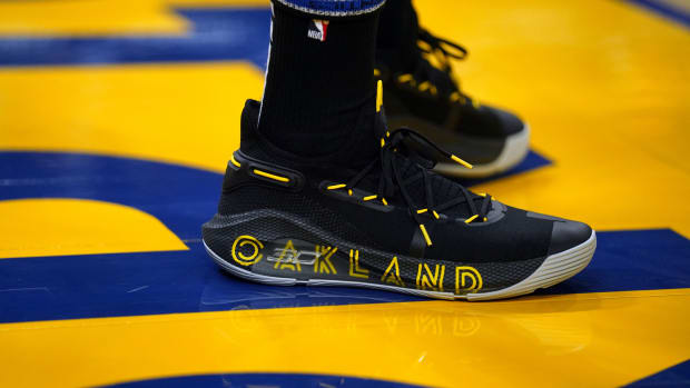 Golden State Warriors point guard Stephen Curry wearing the Under Armour Curry 6 'Thank You'.