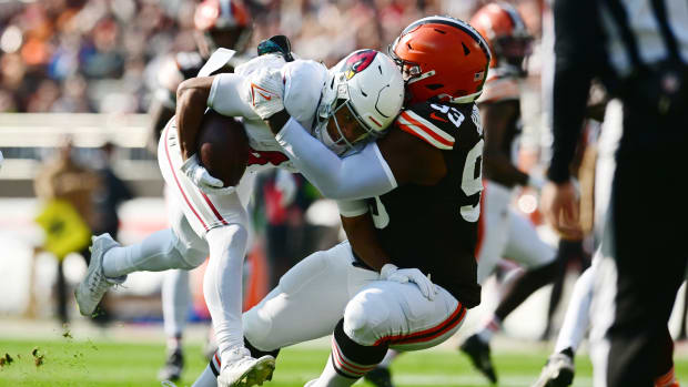 Nov 5, 2023; Cleveland, Ohio, USA; Cleveland Browns defensive tackle Shelby Harris (93) tackles Arizona Cardinals wide receiver Rondale Moore (4) during the first quarter at Cleveland Browns Stadium. Mandatory Credit: Ken Blaze-USA TODAY Sports