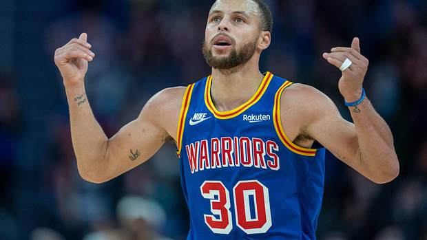 Stephen Curry celebrates a made shot.