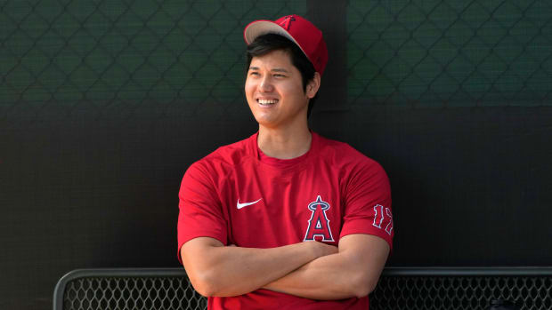 Angels pitcher Shohei Ohtani sits in the dugout.