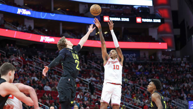 Rockets forward Jabari Smith Jr. shoots the ball over Utah Jazz forward Lauri Markkanen (23) during overtime at Toyota Center.