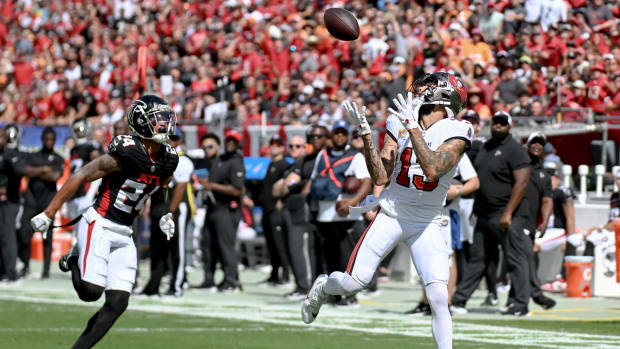 Oct 22, 2023; Tampa, Florida, USA; Tampa Bay Buccaneers wide receiver Mike Evans (13) catches a touchdown pass in the first quarter against the Atlanta Falcons at Raymond James Stadium. Mandatory Credit: Jonathan Dyer-USA TODAY Sports  