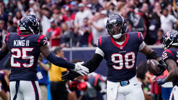 Texans defensive tackle Sheldon Rankins celebrates his touchdown off a ball fumbled by Tennessee Titans quarterback Will Levis during the second quarter at NRG Stadium in Houston, Texas