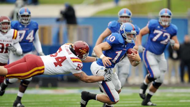 Oct 10, 2009; Lawrence, KS, USA; Kansas Jayhawks wide receiver Kerry Meier (10) is tackled by Iowa State Cyclones linebacker Jesse Smith (54) in the first half at Memorial Stadium. Mandatory Credit: John Rieger-USA TODAY Sports  