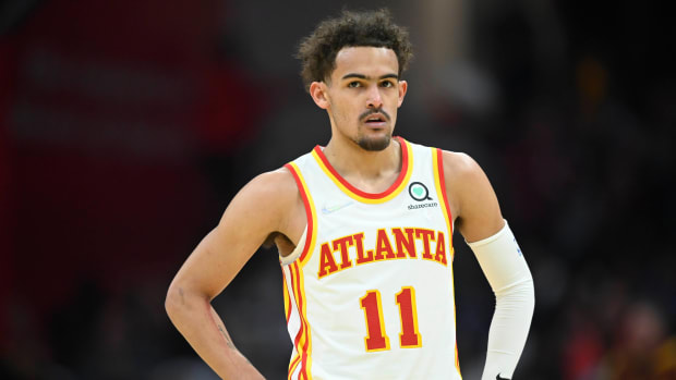 Trae Young standing during a game.