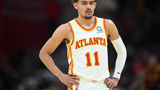 Trae Young standing during a game.