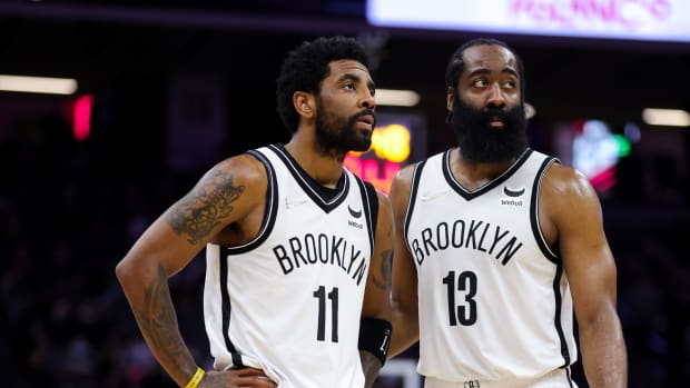 Brooklyn Nets guard Kyrie Irving (11) and guard James Harden (13) talk during the fourth quarter against the Sacramento Kings at Golden 1 Center.