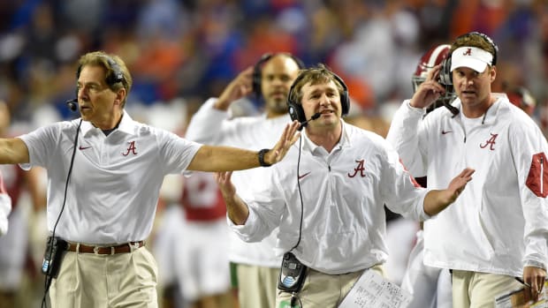 Alabama Crimson Tide head coach Nick Saban (left), defensive coordinator Kirby Smart (center), and offensive coordinator Lane Kiffin (right) react during the second quarter of the 2015 SEC Championship Game.