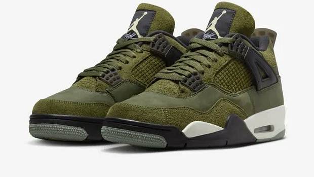 Side view of green and black Air Jordan sneakers.