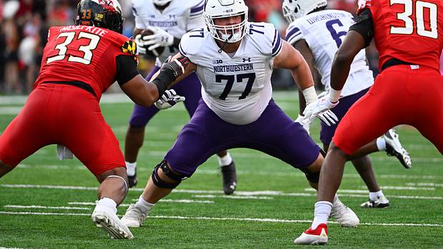 Northwestern Wildcats offensive lineman Peter Skoronski (77) prepares to block against the Maryland Terrapins at SECU Stadium.