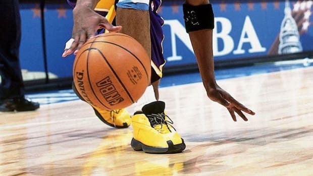 Kobe Bryant dribbling the basketball.