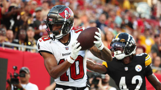 Tampa Bay Buccaneers wide receiver Trey Palmer (10) catches the ball for a touchdown as Pittsburgh Steelers cornerback James Pierre (42) attempted to defend during the first half at Raymond James Stadium.
