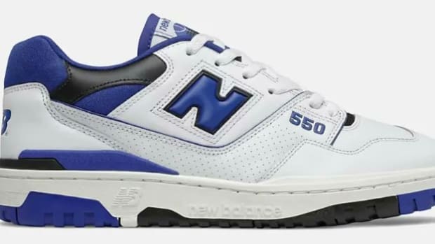 White, blue, and black New Balance shoes.