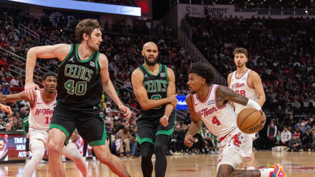 Rockets guard Jalen Green drives to the net against Boston Celtics center Luke Kornet (40) in the second quarter at Toyota Center.