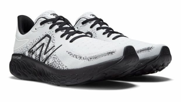 White and black New Balance running shoes.