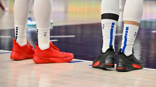 View of Pelicans center Willy Hernangomez and Mavericks guard Luka Doncic's shoes.