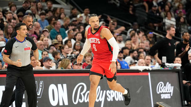 Rockets forward Dillon Brooks (9) reacts after scoring a three-point basket during the second half against the San Antonio Spurs at Frost Bank Center.