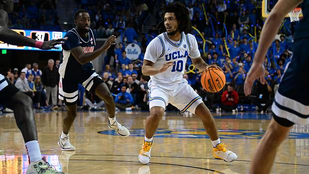 UCLA Bruins guard Tyger Campbell dribbles the ball against the Arizona Wildcats defense.