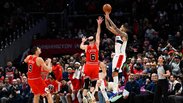Washington Wizards forward Kyle Kuzma hits the game winning three point basket over Chicago Bulls guard Alex Caruso