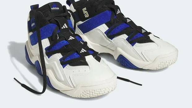 Side view of blue, black, and white adidas sneakers.