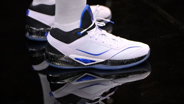 Los Angeles Clippers forward Kawhi Leonard's white, black, and blue New Balance shoes.