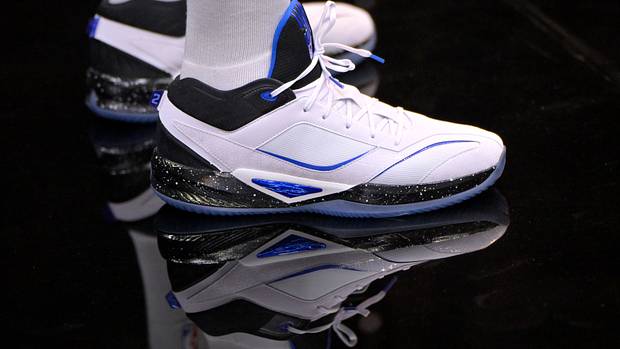 Los Angeles Clippers forward Kawhi Leonard's white, black, and blue New Balance shoes.