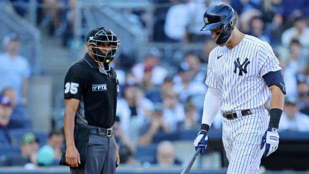 New York Yankees right fielder Aaron Judge (99) complains about a called strike three against the Cleveland Guardians with home plate umpire Jeremie Rehak (35) during the fifth inning in game two ... Brad Penner-USA TODAY Sports