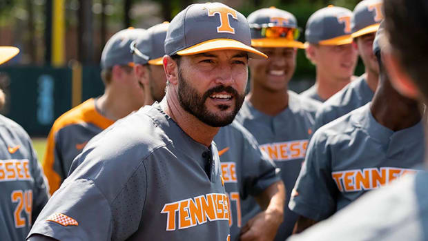 Tennessee baseball coach and former Arkansas assistant Tony Vitello talks with his players.