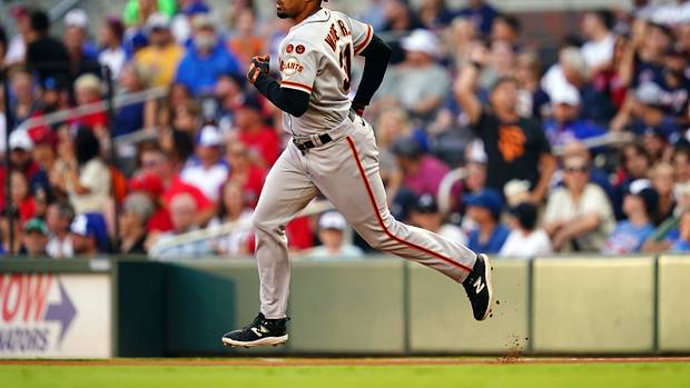 SF Giants first baseman LaMonte Wade Jr. rounds the bases on his solo homer against the Atlanta Braves during the first inning at Truist Park on August 19, 2023.