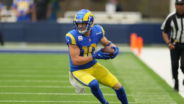 Rams wide receiver Cooper Kupp carries the ball.