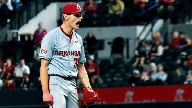Arkansas pitcher Jake Faherty gets hyped after getting out No. 2 in the ninth against Oklahoma State at Globe Life Field.
