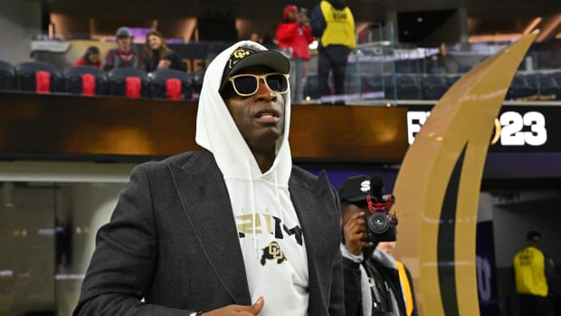 Deion Sanders watches the CFP National Championship Game.