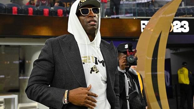Deion Sanders watches the CFP National Championship Game.