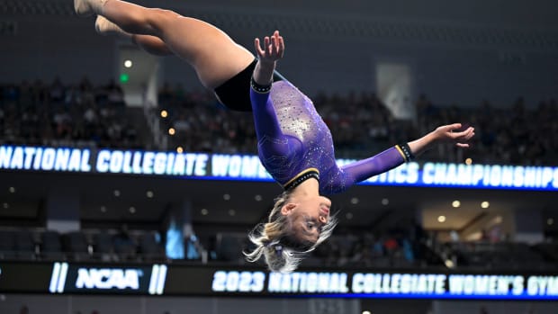 Apr 15, 2023; Fort Worth, TX, USA; LSU Tigers gymnast Olivia Dunne warms up with her team on floor during the NCAA Women's National Gymnastics Tournament Championship at Dickies Arena.