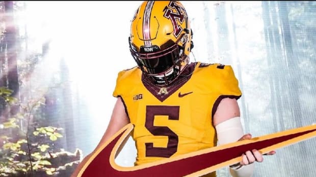 Fayetteville quarterback Drake Lindsey poses with a Nike swoosh in a photo for his Minnesota Golden Golphers recruiting.