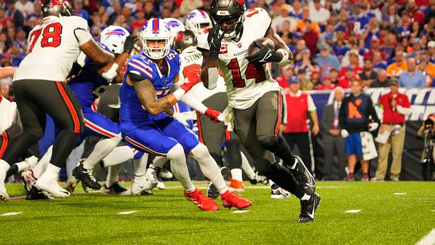 Tampa Bay Buccaneers wide receiver Chris Godwin (14) runs with the ball against the Buffalo Bills during the first half at Highmark Stadium.
