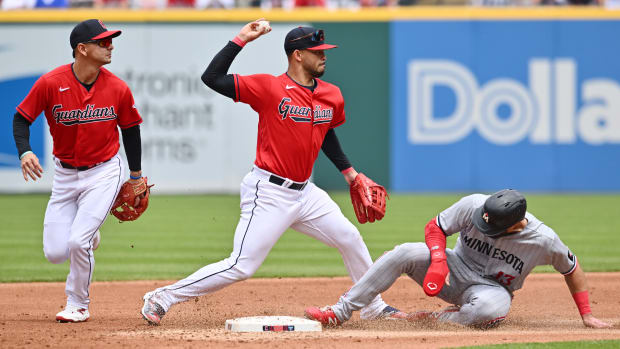 May 7, 2023; Cleveland, Ohio, USA; Cleveland Guardians shortstop Gabriel Arias (13) forces out Minnesota Twins left fielder Joey Gallo (13) and turns the double play as second baseman Andres Gimenez (0) watches during the second inning at Progressive Field. Mandatory Credit: Ken Blaze-USA TODAY Sports
