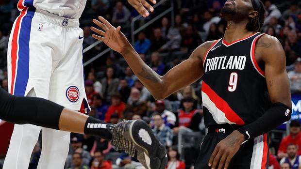 Detroit Pistons center James Wiseman (13) shoots on Portland Trail Blazers forward Jerami Grant (9) in the second half at Little Caesars Arena. Mandatory Credit Rick Osentoski-USA TODAY Sports