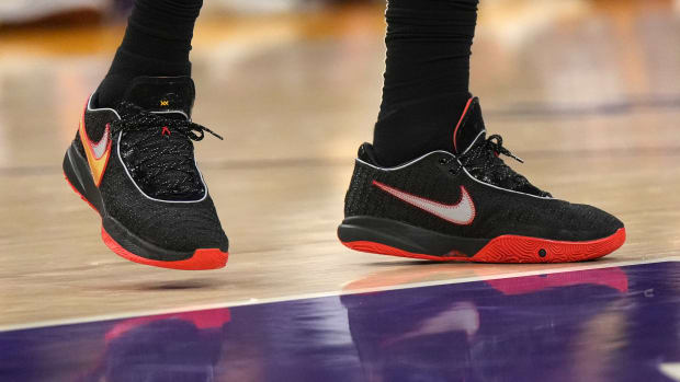 View of LeBron James' black and red Nike shoes.
