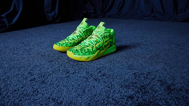 Side view of LaMelo Ball's green and yellow PUMA basketball shoes.