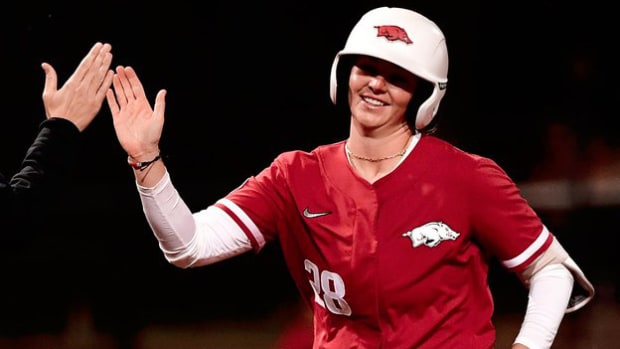 The Razorbacks' Rylin Hedgecock celebrates a massive home run in the seventh inning to put the game away against Notre Dame.