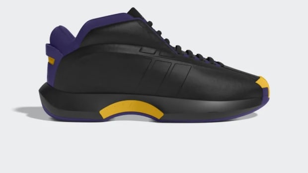 Side view of Kobe Bryant's black and purple adidas sneakers.