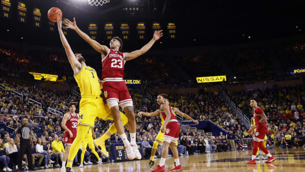 Michigan Wolverines center Hunter Dickinson (1) and Indiana Hoosiers forward Trayce Jackson-Davis (23) battle for the ball in the first half at Crisler Center.