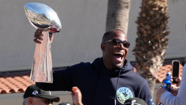 Feb 16, 2022; Los Angeles, CA, USA; Los Angeles Rams defensive coordinator Raheem Morris holds the Vince Lombardi trophy during Super Bowl LVI championship rally at the Los Angeles Memorial Coliseum. Mandatory Credit: Kirby Lee-USA TODAY Sports
