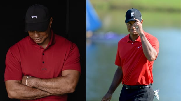 Tiger Woods wearing red and black golf apparel.
