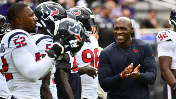 Houston Texans coach DeMeco Ryans (blue shirt) says it doesn’t mean anything to him that some fans left early in the team’s Week 9 win over the Tampa Bay Buccaneers.