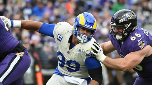 Los Angeles Rams defensive end Aaron Donald (99) rushes Baltimore Ravens quarterback Tyler Huntley (not pictured) as guard Ben Cleveland (66) attempts to block at M&T Bank Stadium.