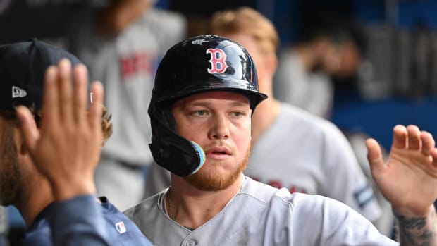 Sep 16, 2023; Toronto, Ontario, CAN; Boston Red Sox right fielder Alex Verdugo (99) celebrates with teammates in the dugout after scoring against the Toronto Blue Jays in the 12th inning at Rogers Centre. Mandatory Credit: Dan Hamilton-USA TODAY Sports  