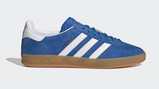 Side view of blue and white adidas sneakers.