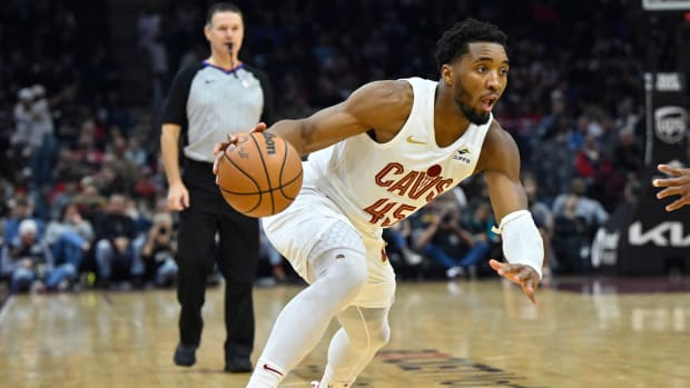 Dec 18, 2023; Cleveland, Ohio, USA; Cleveland Cavaliers guard Donovan Mitchell (45) dribbles in the second quarter against the Houston Rockets at Rocket Mortgage FieldHouse.